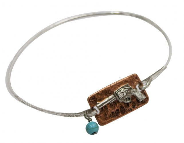Thin silver bangle with copper plate and pistol.
